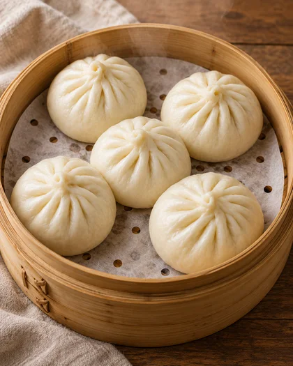AI-generated editorial view of round pleated baozi in a bamboo steamer